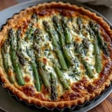 Creamy quiche with tender asparagus and melted Brie, baked until golden and ready to slice.  