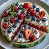 Enjoy this easy, refreshing 4th of July Watermelon Pizza with a sweet cream cheese frosting.