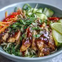 Fork-tender Asian Chicken Noodle Bowl loaded with crisp veggies and savory sauce.